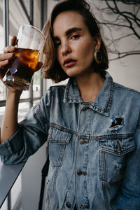 Young woman drinking beer glass