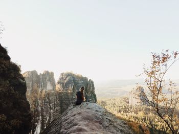 Rear view of man against clear sky