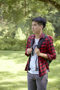 Young man standing on field