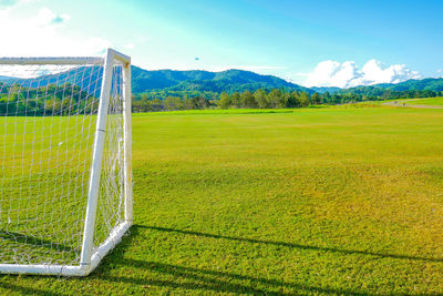 Scenic view of soccer field against sky