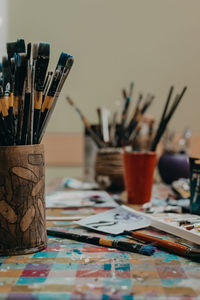 Close-up of paintbrushes on table