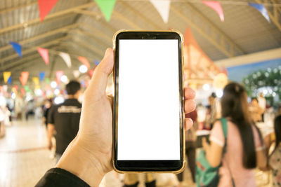 Close-up of hand holding mobile phone