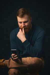 Young man using mobile phone