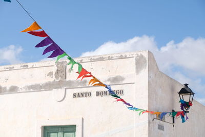 Low angle view of flags against building