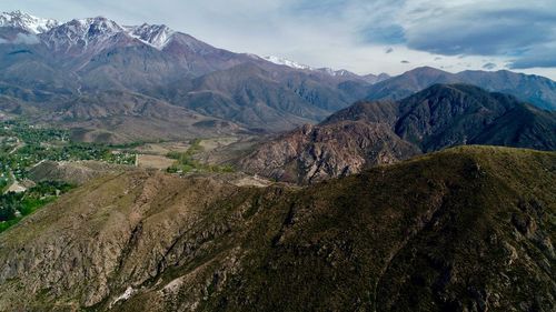 Scenic view of landscape and mountains against sky