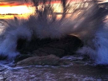 Scenic view of sea at sunset