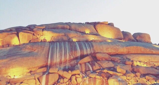 rock formation, clear sky, geology, rock - object, physical geography, tranquility, tranquil scene, nature, natural pattern, scenics, beauty in nature, eroded, low angle view, copy space, textured, non-urban scene, no people, mountain, rock, arid climate