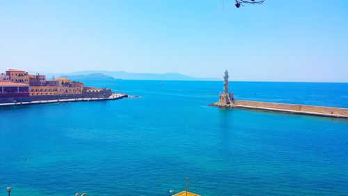 Scenic view of sea against clear blue sky