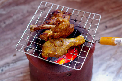 Close-up of meat on barbecue grill