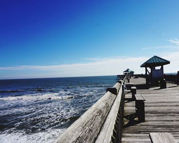 Pier on sea against sky