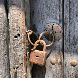 Close-up of padlock on metal door