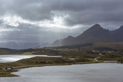 Scenic view of lake and mountains against sky