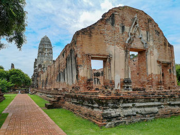 Exterior of old temple building against sky