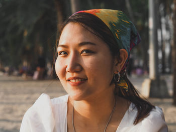 Close-up portrait of a smiling young woman