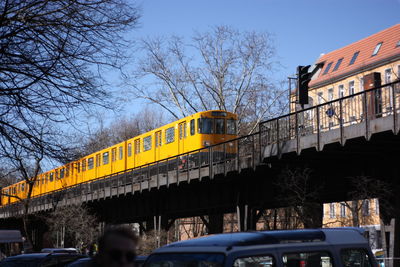 Low angle view of train on bridge against clear sky