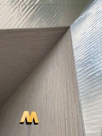 Low angle view of text on wall in building