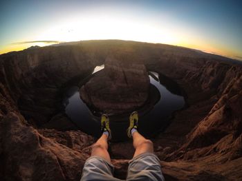 Low section of man standing on rock formation