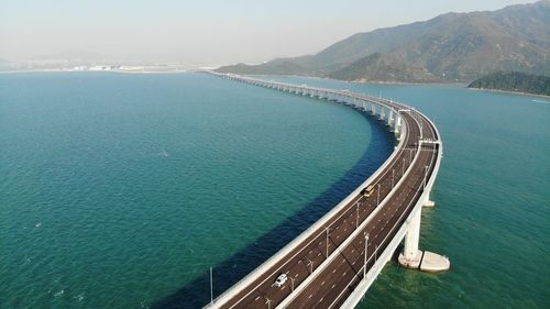 High angle view of dam by sea against sky