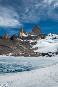 Scenic view of snowcapped mountains against sky