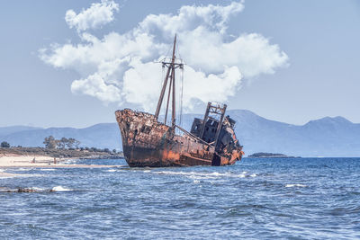 Sailboat on sea against sky