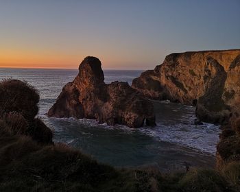 Scenic view of sea against clear sky during sunset