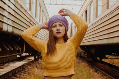 Portrait of beautiful young woman in train