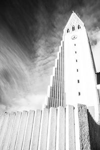 Low angle view of building against cloudy sky