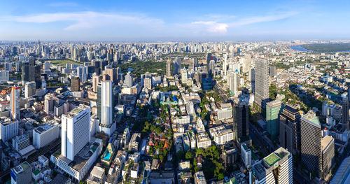 High angle view of modern buildings in city against sky