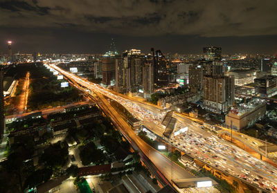 High angle view of illuminated city buildings at night