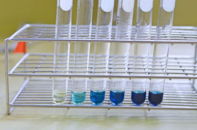 Close-up of glasses on wooden floor