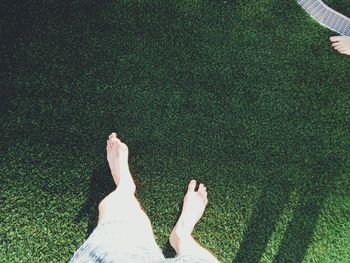 Low section of man walking on field