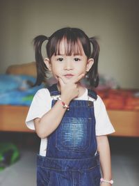 Portrait of girl standing at home