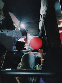 Rear view of people sitting in restaurant