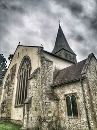 Low angle view of old building against sky