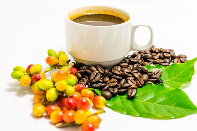 Close-up of coffee beans against white background