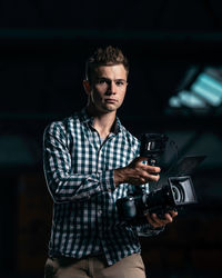 Portrait of young man photographing