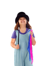 Portrait of smiling girl standing against white background