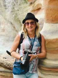 Young woman photographing with camera