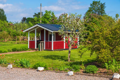 Allotment garden with a idyllic red cottage