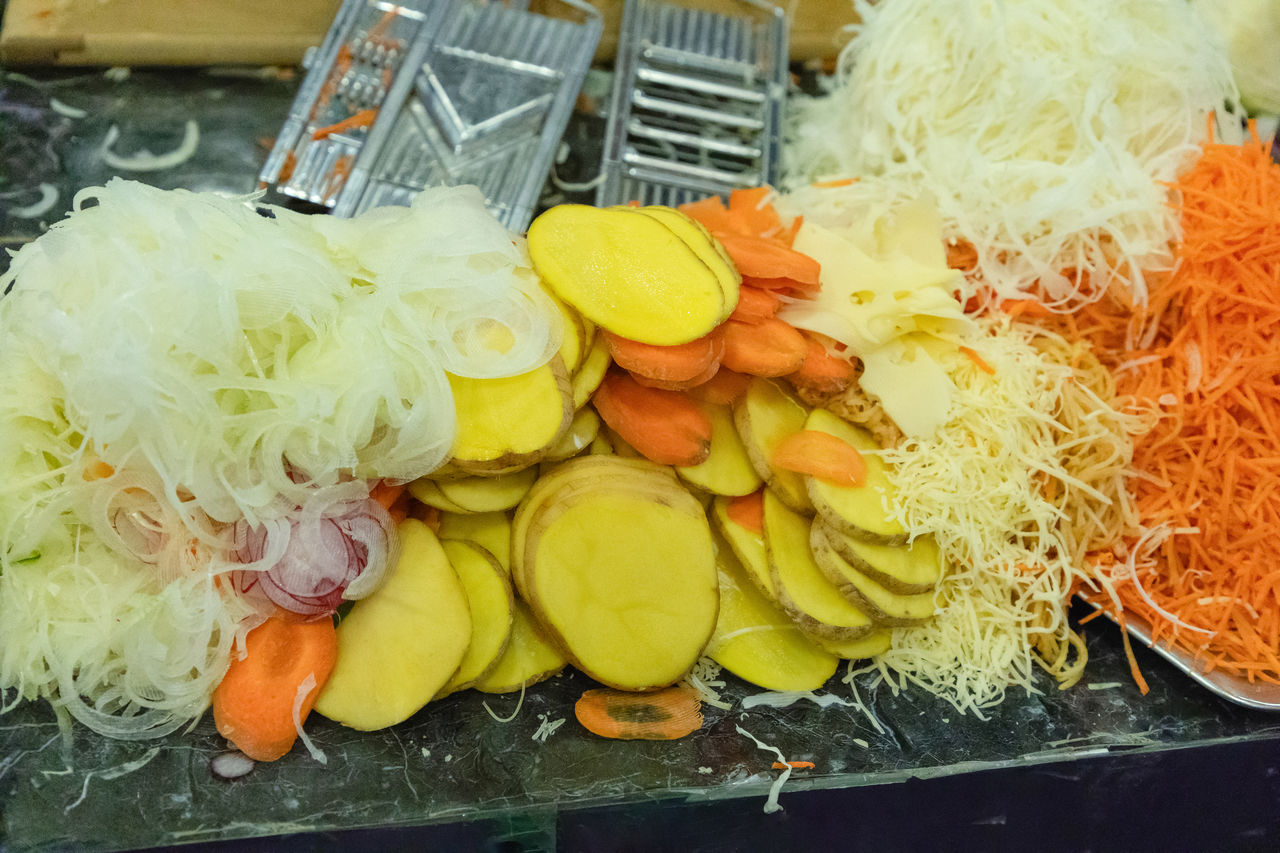 food, food and drink, dish, meal, freshness, healthy eating, cuisine, yellow, high angle view, variation, no people, wellbeing, produce, cabbage, indoors, retail, vegetable, for sale, market, container, still life, business, fruit, large group of objects