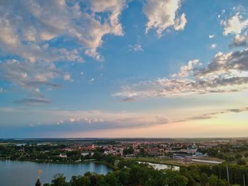 High angle view of city buildings against sky during sunset