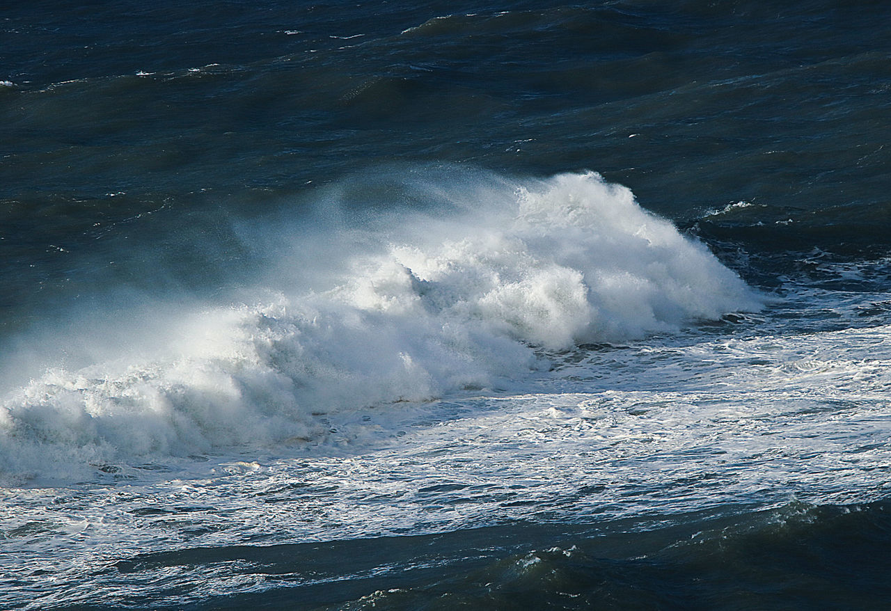 WAVES SPLASHING ON SHORE