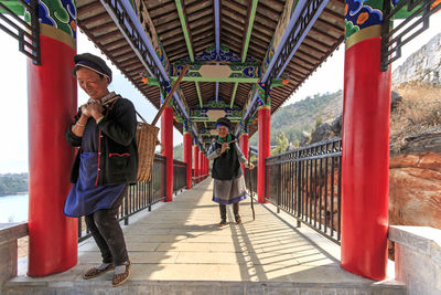 Man standing on bridge