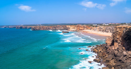 Scenic view of sea against blue sky