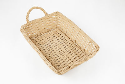 High angle view of wicker basket on white background