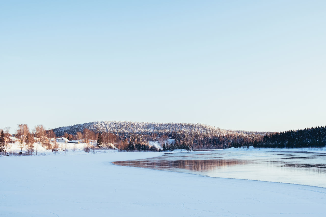 SCENIC VIEW OF SNOW COVERED LANDSCAPE AGAINST SKY