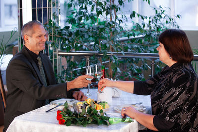 Man and woman sitting in restaurant