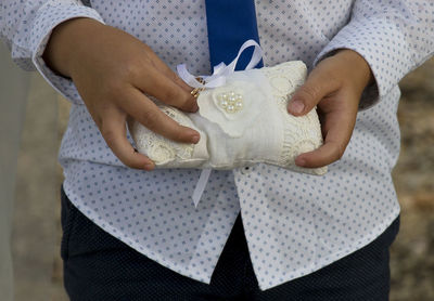 Close-up of couple holding hands