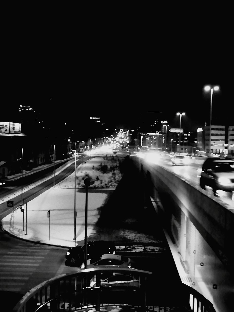 illuminated, night, transportation, mode of transport, city, blurred motion, motion, car, road, city life, street, speed, built structure, building exterior, architecture, outdoors, land vehicle, no people, high street