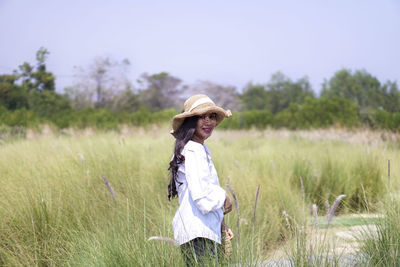 Side view of woman on field